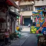 Ordinary Asian street with a set up for a puppet theater. Photo: File photo.