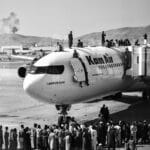 Afghans storming the Kabul Airport days before US Army's abandonment of the country. Photo: Wakil Kohsar/AFP.