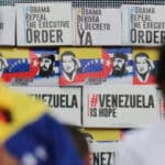 Venezuelan President Nicolás Maduro (left) and former Bolivian President Evo Morales (right), with a wall in the background with banner captioning "#ObamaRepealTheExecutiveOrder," "#ObamaDerogaElDecretoYa," "#VenezuelaIsHope," during a ceremony when more that 13 million signatures were collected rejecting the White House decision declaring Venezuela an "unusual and extraordinary threat" to US security, Caracas, April 2015. Photo: File photo.