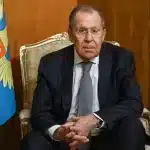 Russia's Foreign Affairs Minister Sergey Lavrov seated on a chair next to the Russian coat of arms. Photo: Russian Ministry for Foreign Affairs/File photo.