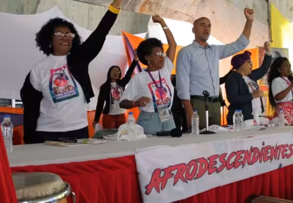 Miranda state governor, Héctor Rodríguez Castro, next to Casimira Monasterios (left), during the closing ceremony of the third Afro-Venezuelan National Congress in Caracas, Sunday, February 26, 2023. Photo: Miranda Governor Office.