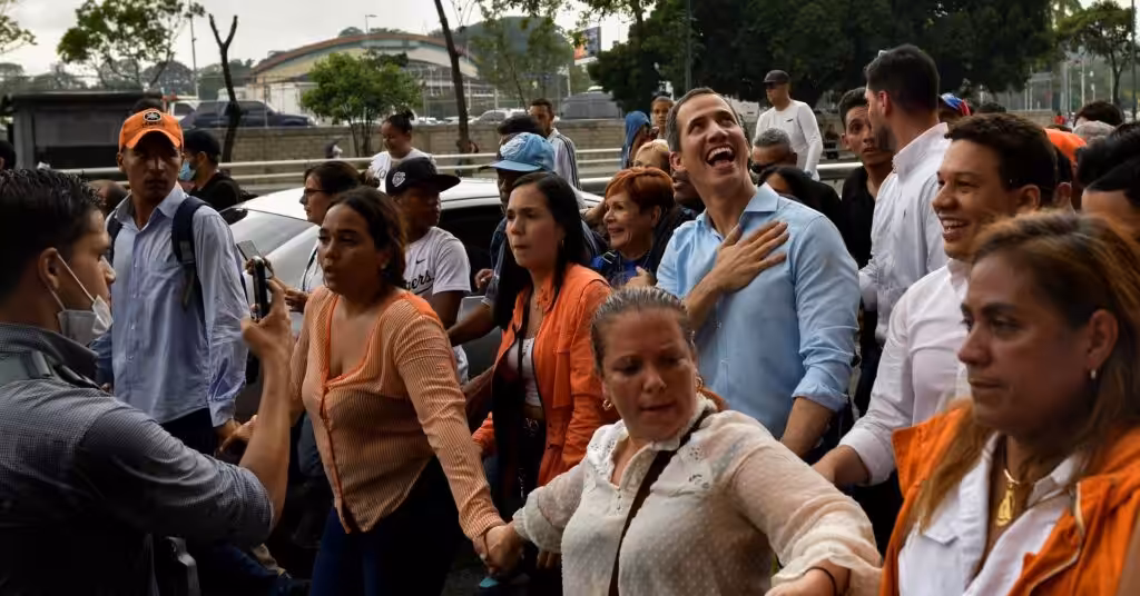 Disqualified opposition candidate Juan Guaidó smiles at supporters during a 2022 rally in Caracas. Photo: REUTERS/Gaby Oraa.