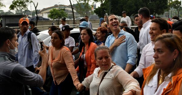 Disqualified opposition candidate Juan Guaidó smiles at supporters during a 2022 rally in Caracas. Photo: REUTERS/Gaby Oraa.