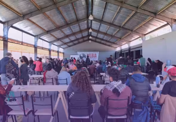 Attendees listening to a presentation during the third Continental Assembly of ALBA Movements, April 2022. Photo: CapireMov.