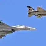 Venezuelan Air Force F-16 (front) and Su-30MK2 (back) during a flyover. Photo: FANB/File photo.