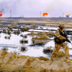A British soldier patrols the Rumaila oil field in southern Iraq, 1 February 2005. BP was awarded the contract to be lead operator of the field four years later. Photo: Andrew Parsons/AFP via Getty.