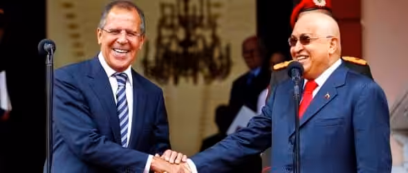 Russian Foreign Minister Sergey Lavrov (left) and Venezuelan President Hugo Chavez (right) bold due to his cancer treatment and laughing in front of cameras during Lavrov's visit to Caracas in 2011. Photo: Reuters/File photo.