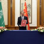 Wang Yi, center, China’s top foreign policy official, with Ali Shamkhani, right, the secretary of Iran’s security council, and Musaad bin Mohammed Al Aiban, Saudi Arabia’s minister of state, in Beijing during the ceremony marking the resumption of diplomatic relations between Iran and Saudi Arabia, March 10, 2023. Photo: China Daily.
