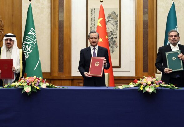Wang Yi, center, China’s top foreign policy official, with Ali Shamkhani, right, the secretary of Iran’s security council, and Musaad bin Mohammed Al Aiban, Saudi Arabia’s minister of state, in Beijing during the ceremony marking the resumption of diplomatic relations between Iran and Saudi Arabia, March 10, 2023. Photo: China Daily.