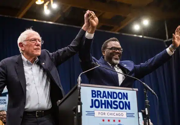 Bernie Sanders (left) and Chicago’s mayoral candidate Brandon Johnson (right)  at Credit Union 1 Arena on March 30, 2023. Photo: Colin Boyle/Block Club Chicago.