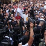 Members of the Palestinian resistance hold their weapons during a memorial service for Mohammed Al-Azizi and Abdul Rahman Sobh, who were killed by Israeli forces in July 2022, in the West Bank city of Nablus. Photo: Shadi Jarar’ah/APA images.