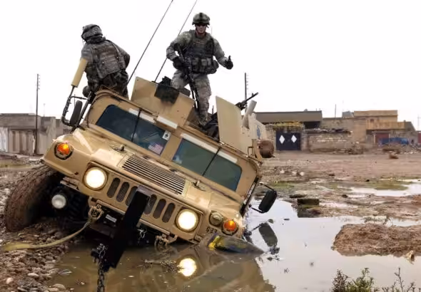 US military vehicles stuck. Photo: Getty Images.