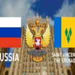 Photo composition: Russian flag (left), Russian coat of arms (center), flag of Saint Vincent and the Grenadines (right), in the background the Ministry of Foreign Affairs of the Russian Federation.