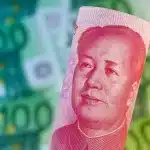 A banknote of China's 100 yuan with a portrait of Mao Zedong over a blurred background of euro banknotes. Photo: Gina Sanders/Fotolia via Wodicka.