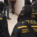 National Anti-Corruption Police (PNCC) agents during a raid in March, 2023. Photo: PNCC/File photo.