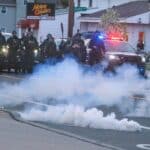 Akron police deploy chemicals to disperse peaceful protesters after the decision to not indict the police that killed Jayland Walker. Photo: Fighting Words.