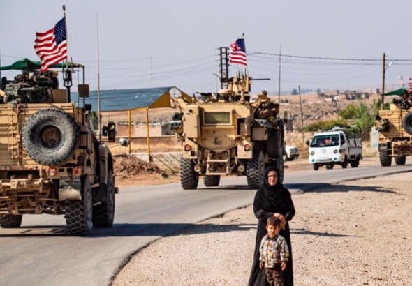 A convoy of US armored vehicles patrolling the occupied territories of northeastern Syria bordering Turkey. Photo: File photo.