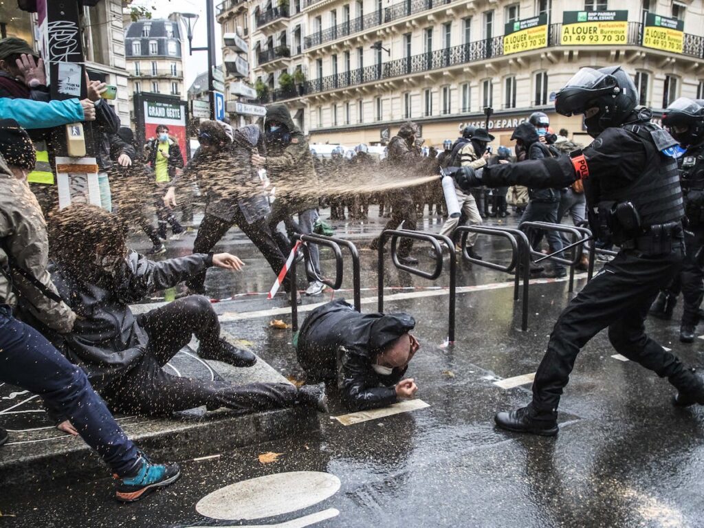 Police attacking demonstrators in France. Photo: EPA