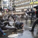 Police attacking demonstrators in France. Photo: EPA
