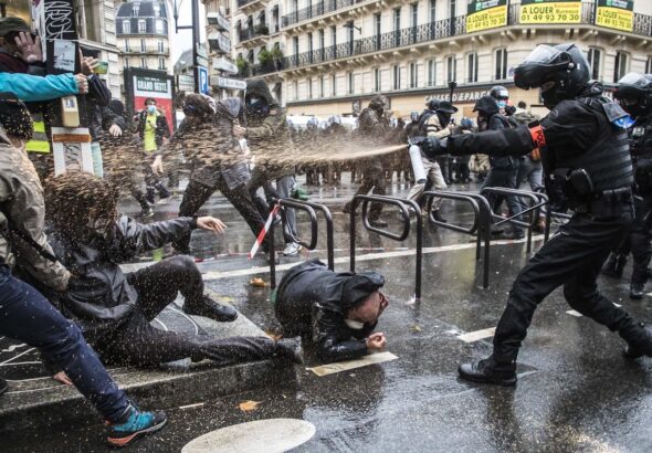 Police attacking demonstrators in France. Photo: EPA