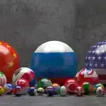 Photo composition showing pool balls with flags of different countries. China, Russia and the US are the biggest balls while Japan, India, South Korea, UK, Germany and France follow in size along 21 smaller flags. Photo: Russian International Affairs Council.