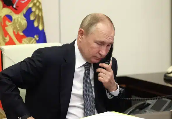 Russian President Vladimir Putin talking on the phone in his Kremlin office. Photo: Mikhail Metzel/pool/TASS/File photo.