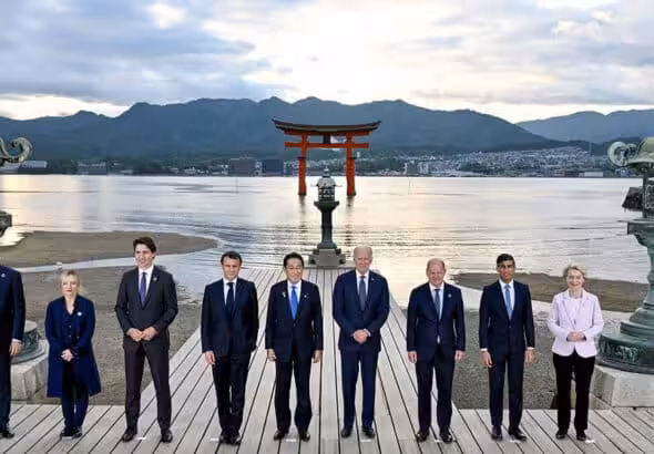Joe Biden, Olaf Scholz, Rishi Sunak, Ursula von der Leyen, Charles Michel, Giorgia Meloni, Justin Trudeau, Emmanuel Macron and Fumio Kishida attend a photo session at Itsukushima Shrine during the G7 leaders' summit in Hatsukaichi, Hiroshima Prefecture, western Japan. Photo: Kenny Holston via Reuters.