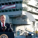 Former US President George W. Bush addresses the nation aboard the nuclear aircraft carrier USS Abraham Lincoln on 1 May 2003. Photo: Stephen Jaffe/AFP via Getty Images.
