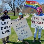 US activists holding banners showing their solidarity with Cuba. Photo: Susan Ruggles.