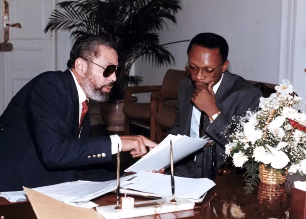 Ambassador at Large Ben Dupuy with President Jean-Bertrand Aristide in 1991. Photo: File photo.