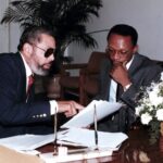 Ambassador at Large Ben Dupuy with President Jean-Bertrand Aristide in 1991. Photo: File photo.