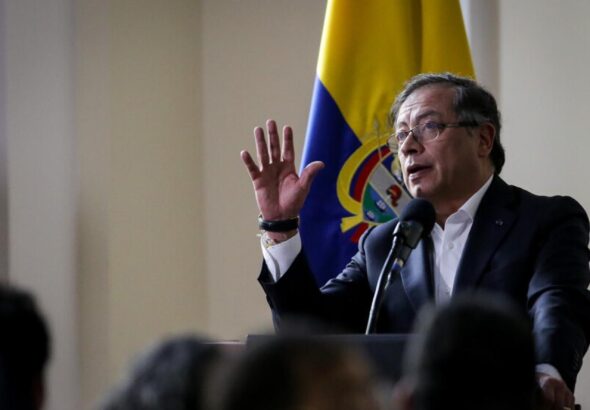 Colombian President Gustavo Petro speaks, with a Colombian flag in the background. Photo: Colprensa.
