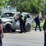 Police officers inspecting the SUV involved in a tragic incident resulting in the death of eight migrants in Brownsville, Texas, on Sunday, May 7. Photo: CNN.