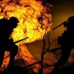 Illustration of war showing an explosion and two soldiers running. Photo: Mohamed Hasan/Pixabay.