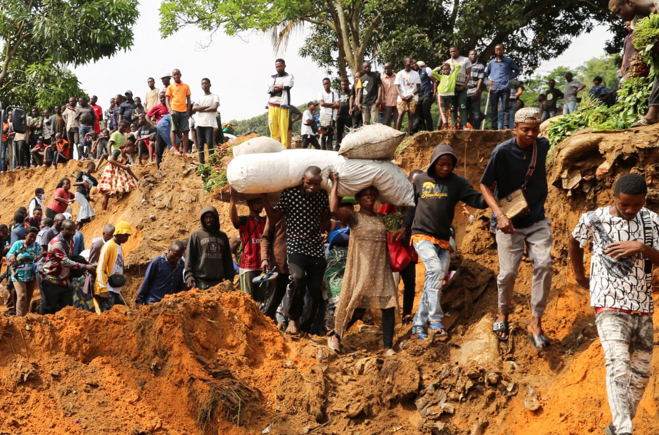 Local residents make their way through a seriously damaged road following heavy rains that caused floods and landslides, on the outskirts of Kinshasa, Democratic Republic of Congo, Dec 14 2022. Photo: Reuters/Justin Makangara/Referential photo.
