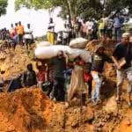 Local residents make their way through a seriously damaged road following heavy rains that caused floods and landslides, on the outskirts of Kinshasa, Democratic Republic of Congo, Dec 14 2022. Photo: Reuters/Justin Makangara/Referential photo.