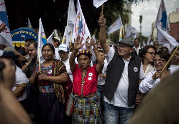 Thelma Cabrera, Guatemalan indigenous activist and presidential aspirant from the MLP party; Neftalí Matías López Miranda, indigenous scholar and political consultant; and their supporters arriving at the Plaza de la Constitución during the closing of the MLP's campaign. Photo: Simone Dalmasso.