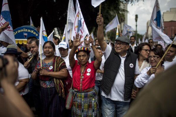 Thelma Cabrera, Guatemalan indigenous activist and presidential aspirant from the MLP party; Neftalí Matías López Miranda, indigenous scholar and political consultant; and their supporters arriving at the Plaza de la Constitución during the closing of the MLP's campaign. Photo: Simone Dalmasso.