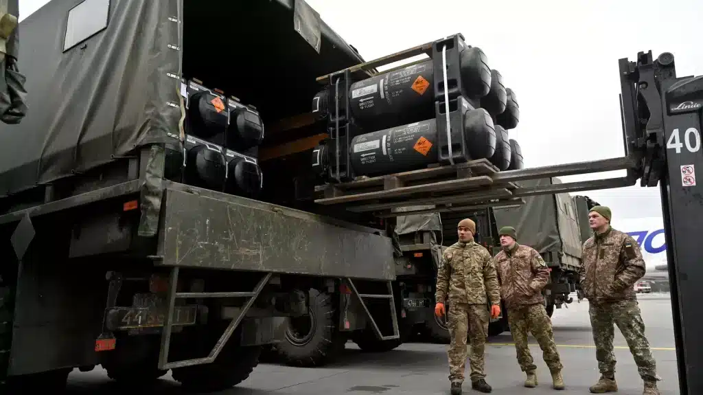 A group of Ukrainian soldiers receive a shipment of US-made missiles in early February, 2022. Photo: AFP/Sergey Supinsky.