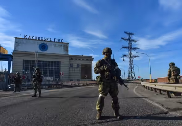 Russian soldiers patrol at the Kakhovka Hydroelectric Power Plant, Kherson, Russia, on May 20, 2022. Photo: AFP/File photo.