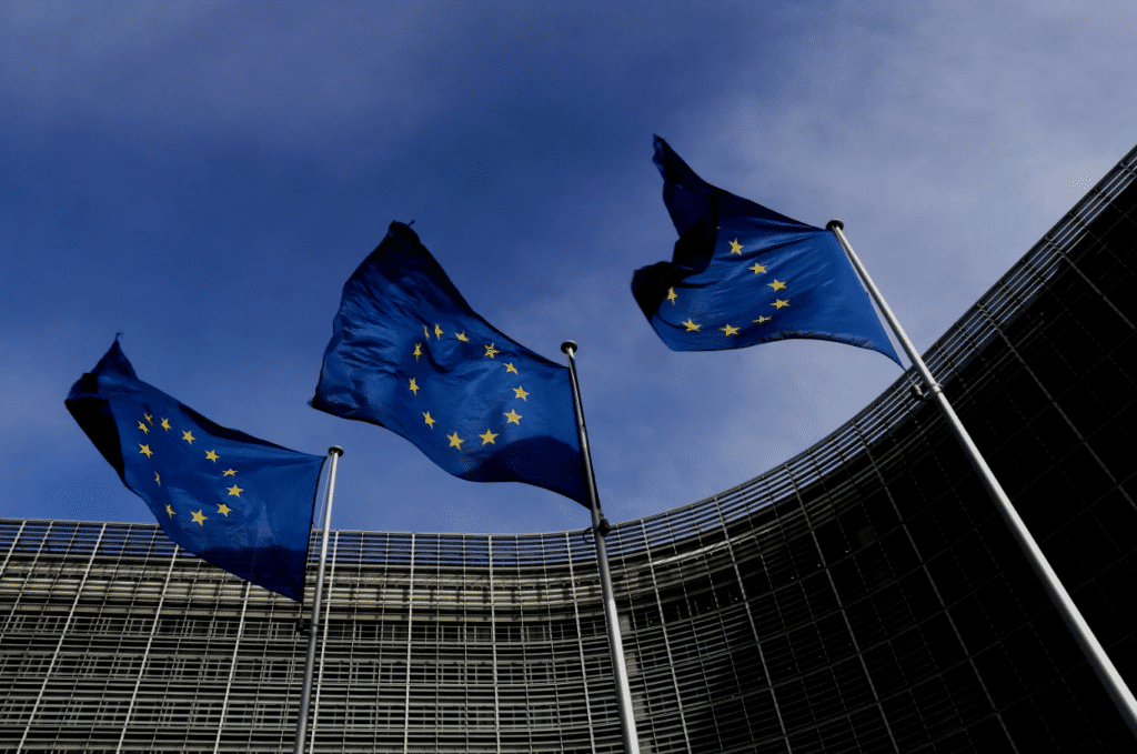 Three EU flags fly outside the EU Commission headquarters in Brussels, Belgium. Photo: Yves Herman/Reuters.