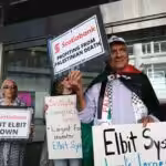 Palestine solidarity activists in Vancouver Canada hold a rally outside the Scotiabank Towers to protest the bank’s investment in elbit systems, June 3, 2023. Photo: Michael Yc Tseng.