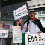 Palestine solidarity activists in Vancouver Canada hold a rally outside the Scotiabank Towers to protest the bank’s investment in elbit systems, June 3, 2023. Photo: Michael Yc Tseng.