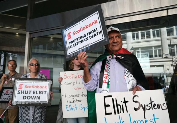 Palestine solidarity activists in Vancouver Canada hold a rally outside the Scotiabank Towers to protest the bank’s investment in elbit systems, June 3, 2023. Photo: Michael Yc Tseng.