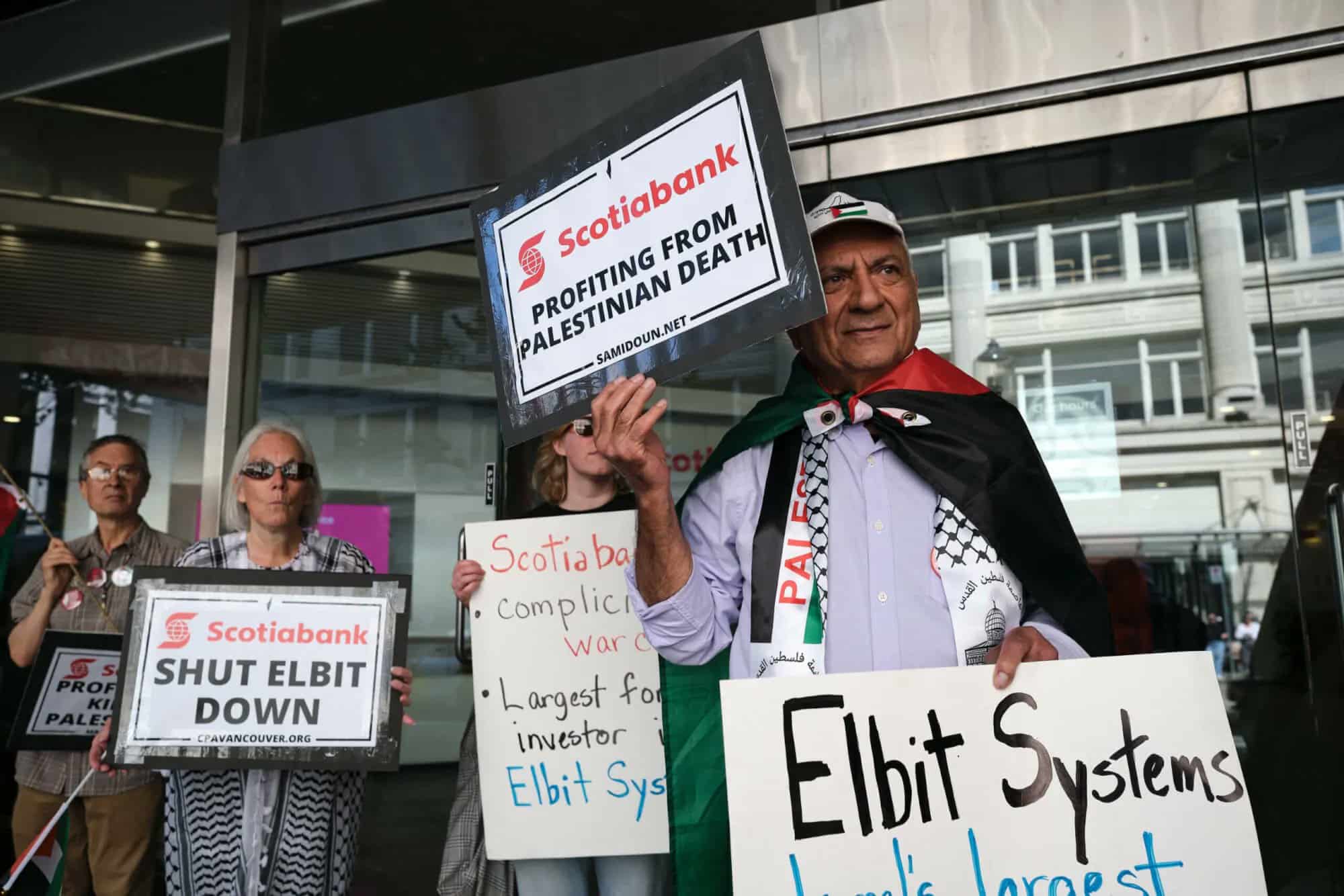 Palestine solidarity activists in Vancouver Canada hold a rally outside the Scotiabank Towers to protest the bank’s investment in elbit systems, June 3, 2023. Photo: Michael Yc Tseng.