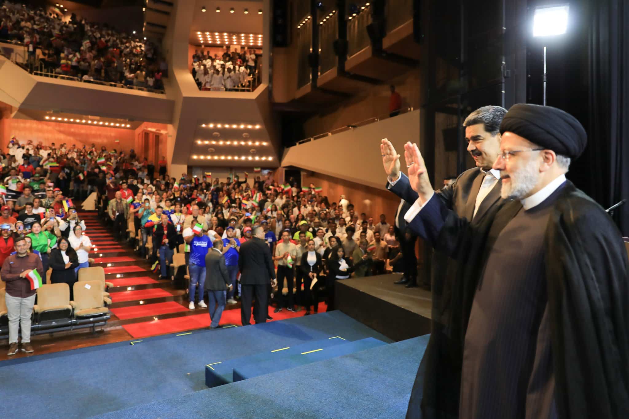 Iranian President Ebrahim Raisi (right) next to Venezuelan President Nicolas Maduro (left) greeting attendees at a youth forum held at the Teresa Carreno Theater in Caracas on Tuesday, June 13, 2023. Photo: Twitter/@NicolasMaduro.