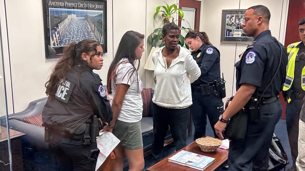 Cuba solidarity activists are arrested inside Senator Bob Menéndez's office in Washington, DC, June 22, 2023. Photo: Bill Hackwell.