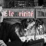 Lebanese Energy Minister Walid Fayyad, with the Lebanese national electricity company in the background. Photo: The Cradle.