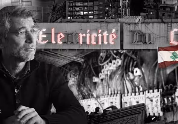 Lebanese Energy Minister Walid Fayyad, with the Lebanese national electricity company in the background. Photo: The Cradle.