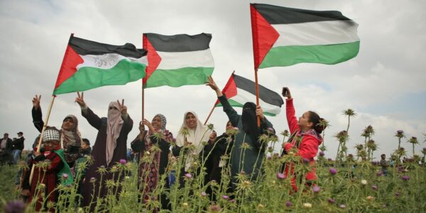 Palestinian women raising the Palestinian flag. File photo.